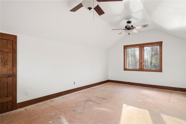 additional living space featuring vaulted ceiling and baseboards