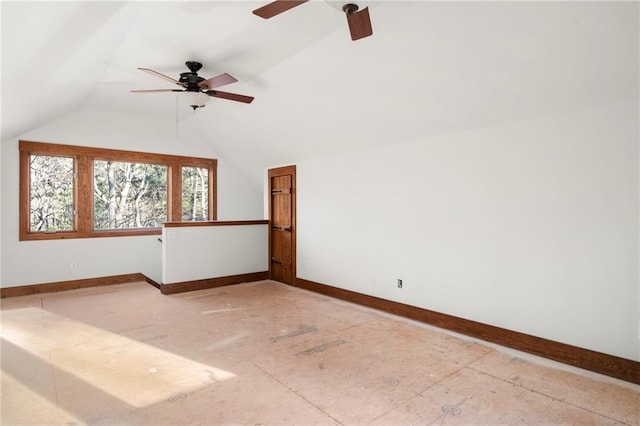 additional living space with lofted ceiling and baseboards