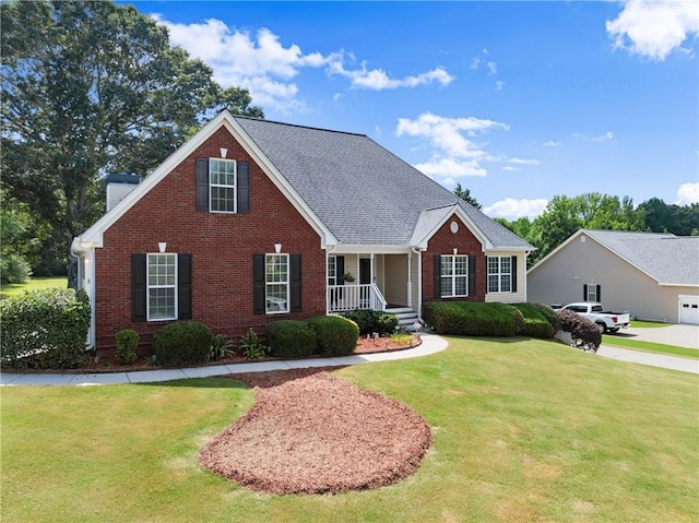 27 Kendall Creek Dr, Jefferson, GA 30549 - traditional-style home with brick siding, a front yard, a porch, and a chimney