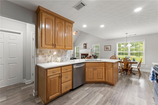 27 Kendall Creek Dr, Jefferson, GA 30549 - kitchen featuring stainless steel dishwasher, light wood-style flooring, light countertops, brown cabinetry, and recessed lighting