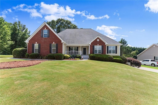 27 Kendall Creek Dr, Jefferson, GA 30549 - view of front of house featuring brick siding, a porch, and a front yard