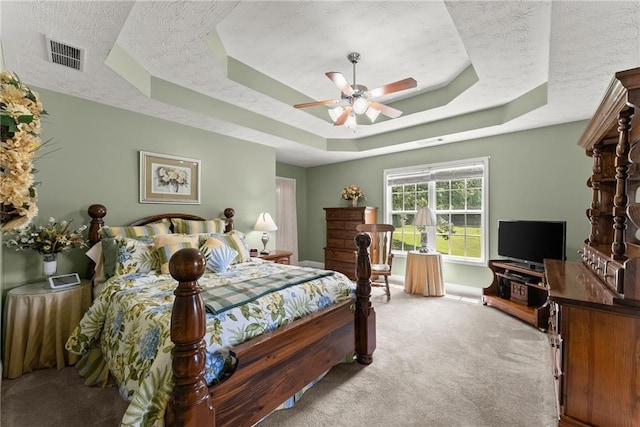 27 Kendall Creek Dr, Jefferson, GA 30549 - carpeted bedroom featuring a tray ceiling and a ceiling fan