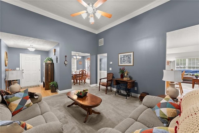 27 Kendall Creek Dr, Jefferson, GA 30549 - living area featuring ornamental molding, a high ceiling, a ceiling fan, and a chandelier
