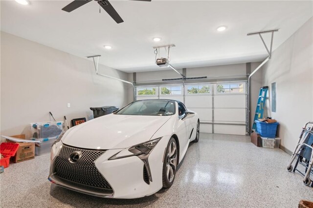 garage with ceiling fan and a garage door opener