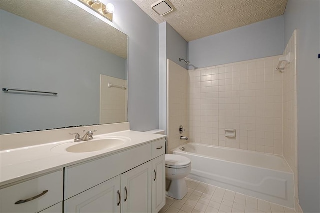 2794 Craig Ct, Marietta, GA 30062 - bathroom featuring vanity, tile patterned flooring, shower / washtub combination, and a textured ceiling