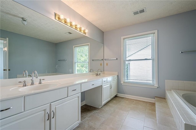 2794 Craig Ct, Marietta, GA 30062 - full bath featuring double vanity, a garden tub, a textured ceiling, and tile patterned floors