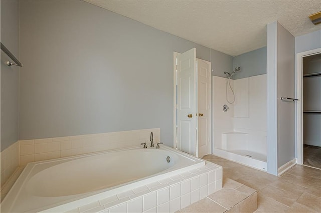 2794 Craig Ct, Marietta, GA 30062 - full bath featuring a bath, a closet, a shower, a textured ceiling, and tile patterned floors