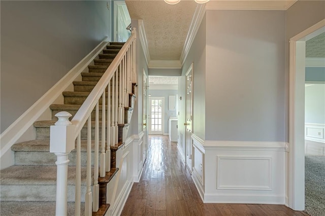 2794 Craig Ct, Marietta, GA 30062 - stairway with ornamental molding, wood-type flooring, a wainscoted wall, and a decorative wall