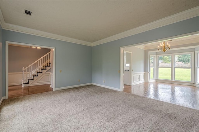 2794 Craig Ct, Marietta, GA 30062 - unfurnished room featuring stairs, carpet floors, a chandelier, crown molding, and wainscoting