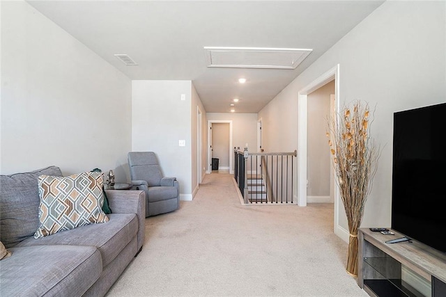 2320 Ridge View Dr, Loganville, GA 30052 - living area featuring attic access, light colored carpet, and baseboards