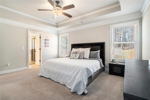 2320 Ridge View Dr, Loganville, GA 30052 - carpeted bedroom featuring a tray ceiling, ornamental molding, baseboards, and a ceiling fan