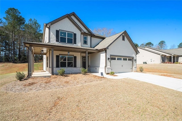 2320 Ridge View Dr, Loganville, GA 30052 - view of front of home featuring covered porch, driveway, and an attached garage