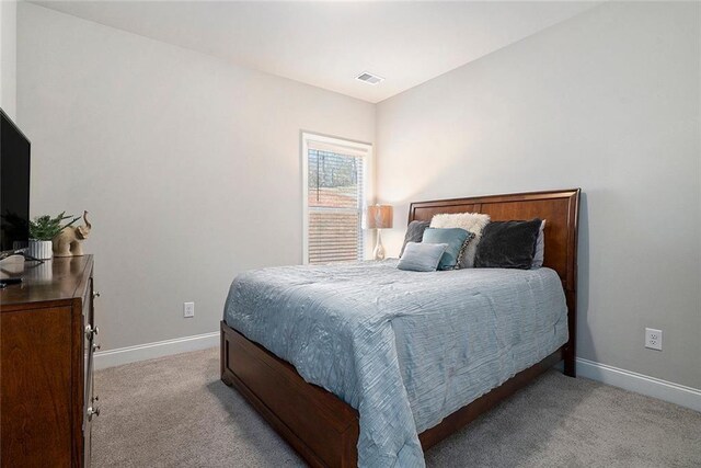 2320 Ridge View Dr, Loganville, GA 30052 - carpeted bedroom featuring baseboards