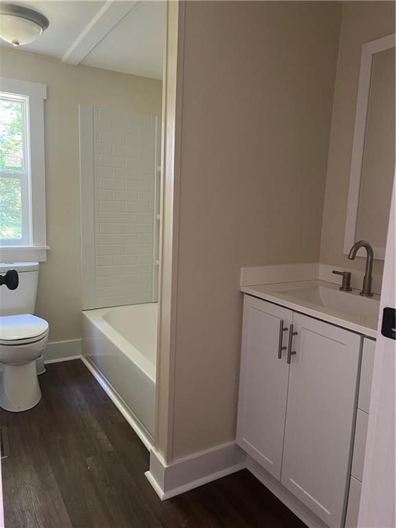 full bathroom with vanity, toilet, hardwood / wood-style floors, and shower / bathing tub combination