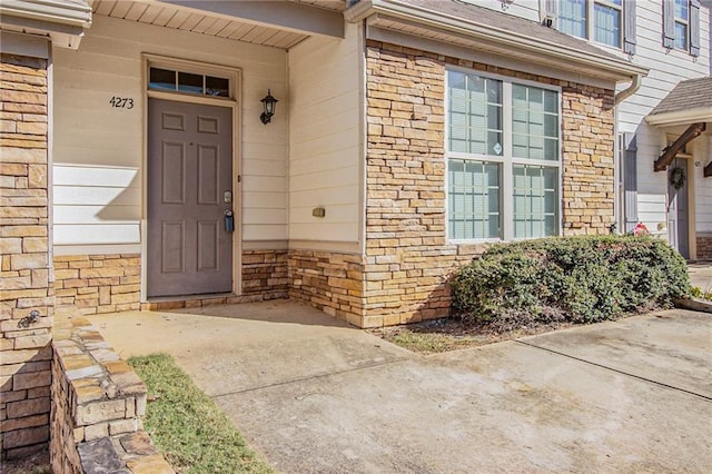 view of exterior entry with stone siding