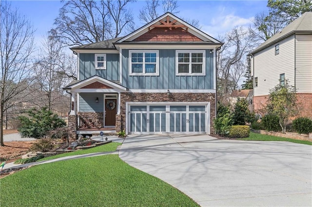 view of front of home with board and batten siding, concrete driveway, a front lawn, and an attached garage