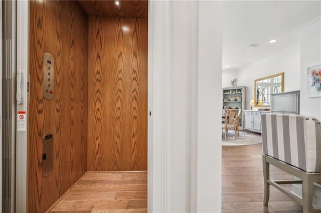 hall featuring elevator, recessed lighting, and wood finished floors