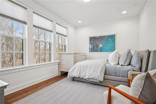 bedroom featuring recessed lighting, baseboards, and wood finished floors