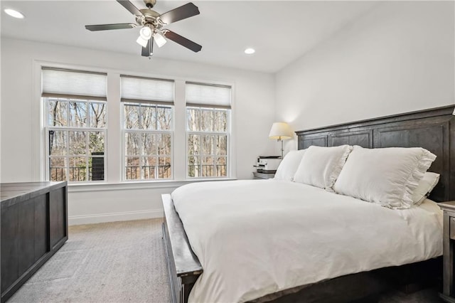 bedroom with recessed lighting, baseboards, light colored carpet, and ceiling fan