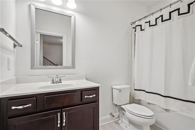 full bathroom with tile patterned floors, toilet, shower / tub combo with curtain, baseboards, and vanity