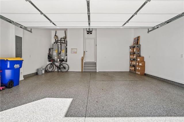 garage with electric panel, electric water heater, and baseboards