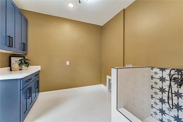 interior space featuring cabinets and light tile patterned flooring