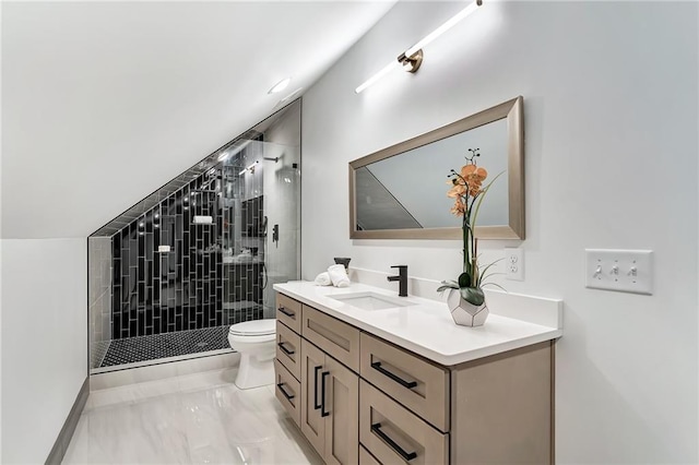 bathroom featuring lofted ceiling, vanity, toilet, and a shower with door