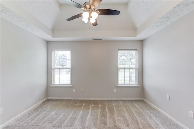 926 Masters Dr, Monroe, GA 30655 - empty room with a raised ceiling, light carpet, and ceiling fan