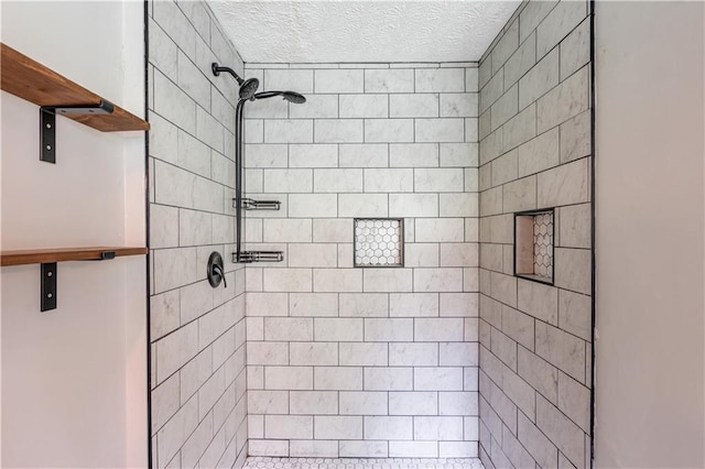 926 Masters Dr, Monroe, GA 30655 - full bath featuring a tile shower and a textured ceiling