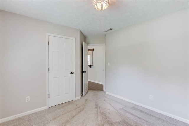926 Masters Dr, Monroe, GA 30655 - spare room with a textured ceiling and carpet floors