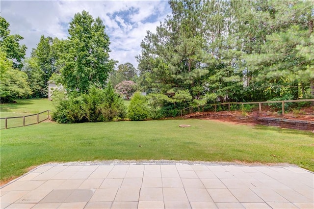 926 Masters Dr, Monroe, GA 30655 - fenced backyard featuring a patio and view of wooded area