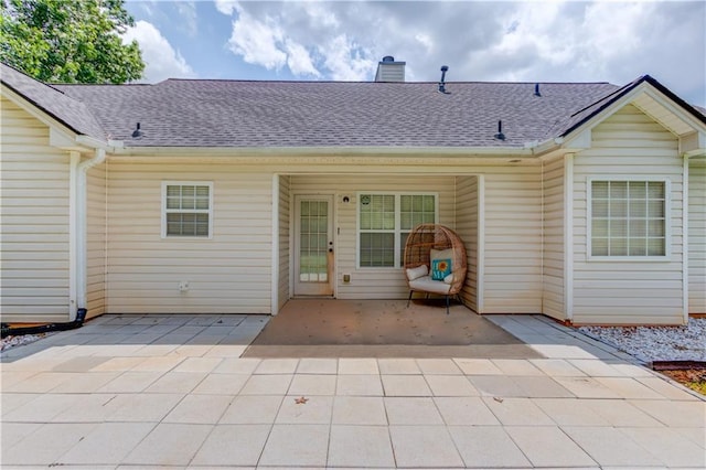 926 Masters Dr, Monroe, GA 30655 - rear view of house with a chimney, a patio area, and roof with shingles