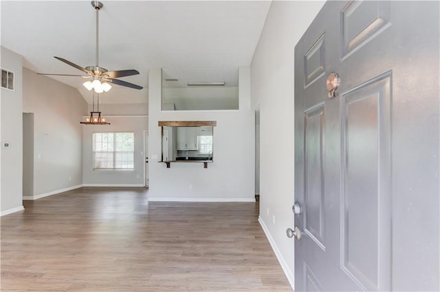 926 Masters Dr, Monroe, GA 30655 - foyer with ceiling fan, wood finished floors, and vaulted ceiling