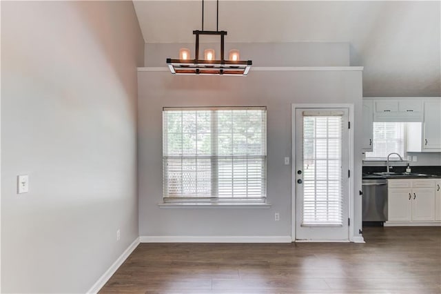 926 Masters Dr, Monroe, GA 30655 - unfurnished dining area with a chandelier and dark wood-type flooring