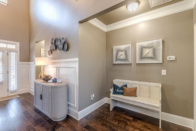 foyer with dark hardwood / wood-style floors and ornamental molding