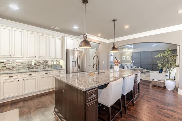 kitchen with stainless steel fridge with ice dispenser, sink, white cabinets, and dark hardwood / wood-style floors