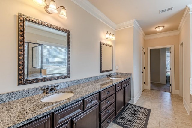 bathroom featuring tile patterned floors, vanity, a tub to relax in, and crown molding