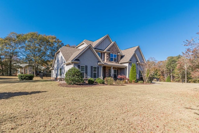 craftsman house with a front lawn