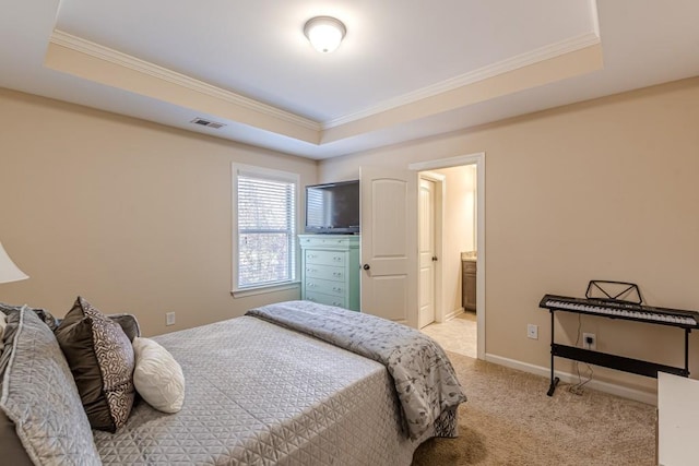 bedroom featuring crown molding, a raised ceiling, and light carpet