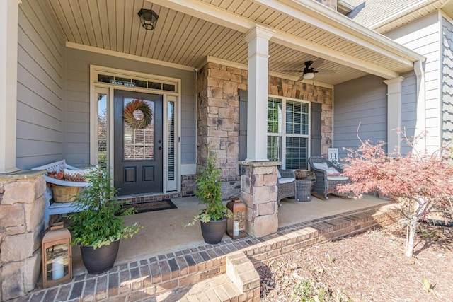 doorway to property featuring a porch and ceiling fan