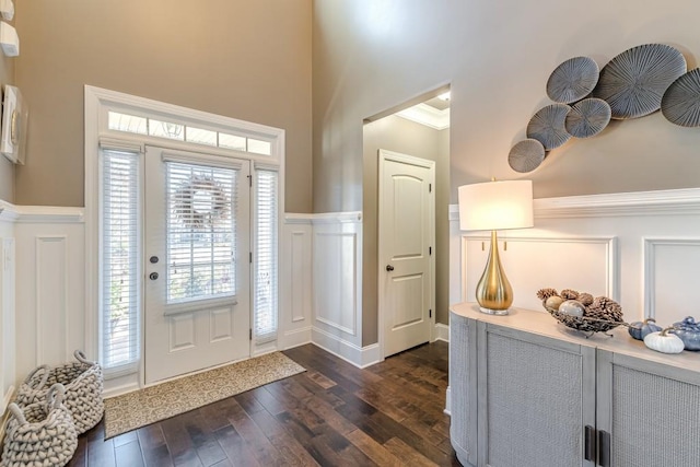 foyer featuring dark hardwood / wood-style floors and ornamental molding