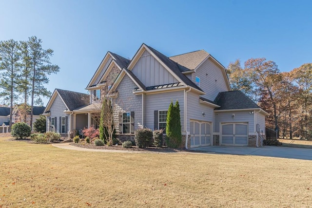 craftsman-style house with a garage and a front lawn