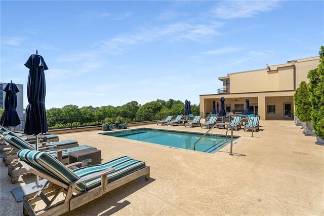 community pool with a patio area