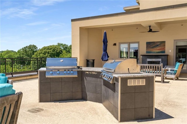 view of patio / terrace featuring area for grilling, grilling area, and ceiling fan