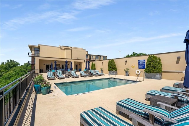 community pool with a patio