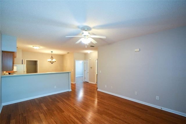 150 Old Mill Rd Unit 115, Cartersville, GA 30120 - unfurnished living room featuring a chandelier, a ceiling fan, and dark wood-style floors