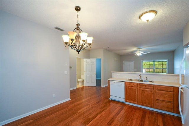150 Old Mill Rd Unit 115, Cartersville, GA 30120 - kitchen featuring white appliances, brown cabinets, dark wood finished floors, a ceiling fan, and a chandelier