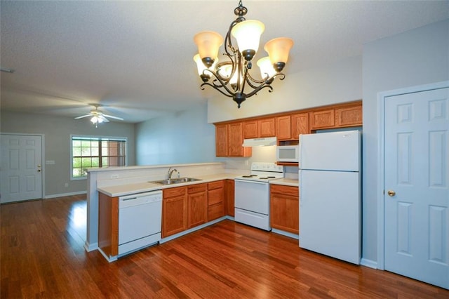 150 Old Mill Rd Unit 115, Cartersville, GA 30120 - kitchen with white appliances, a chandelier, dark wood-style flooring, and a peninsula
