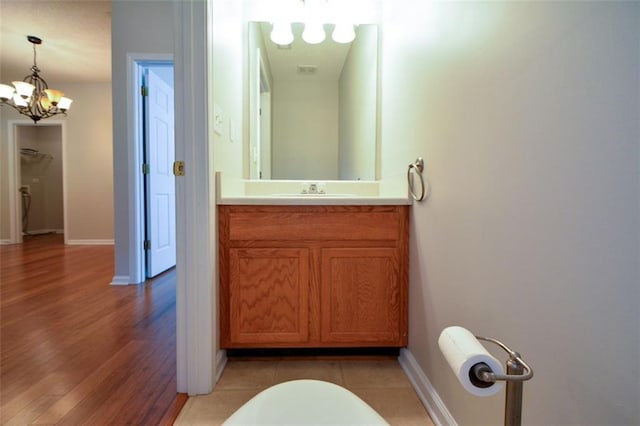 150 Old Mill Rd Unit 115, Cartersville, GA 30120 - bathroom with a chandelier, vanity, and wood finished floors