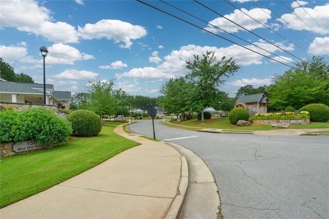 150 Old Mill Rd Unit 115, Cartersville, GA 30120 - view of asphalt street with sidewalks, curbs, street lighting, and traffic signs